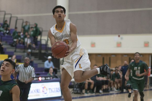 Lemoore's Max Tashima goes for two points in Tuesday's loss to El Diamante